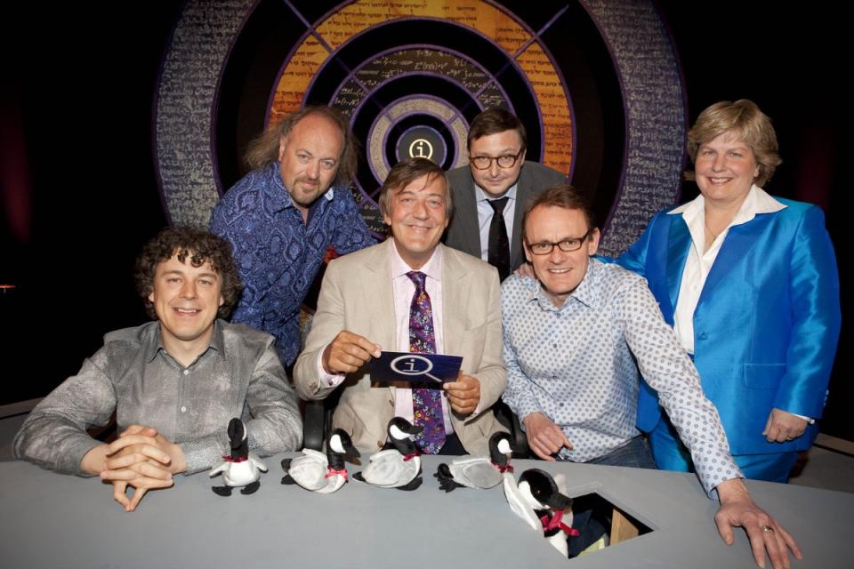 Alan Davies, Bill Bailey, Stephen Fry, John Hodgman, Sean Lock and Sandi Toksvig on the set of ‘QI’ in 2009 (Brian J Ritchie/Talkback Thames/Shutterstock)