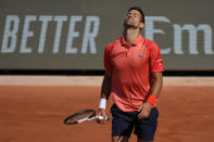 Serbia's Novak Djokovic reacts after missing a shot against Russia's Karen Khachanov during their quarterfinal match of the French Open tennis tournament at the Roland Garros stadium in Paris, Tuesday, June 6, 2023. (AP Photo/Thibault Camus)
