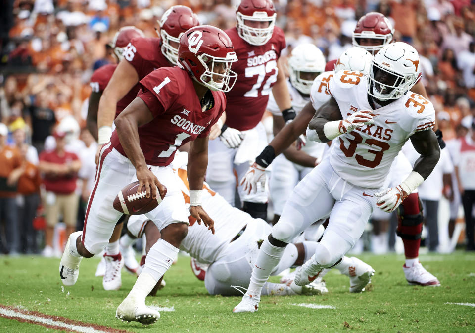 In this Saturday, Oct. 6, 2018, file photo, Oklahoma quarterback Kyler Murray (1) scrambles against Texas during the first half of an NCAA college football game at the Cotton Bowl in Dallas. (AP Photo/Cooper Neill, File)