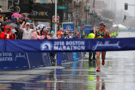 Yuki Kawauchi of Japan comes down Boylston Street to the finish line to win the men's race of the 122nd Boston Marathon in Boston, Massachusetts, U.S., April 16, 2018. REUTERS/Brian Snyder