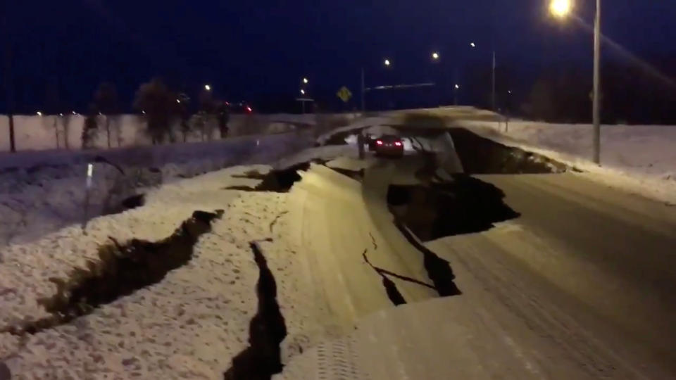 The earthquake literally cracked the road open at the Minnesota Drive exit ramp near Anchorage.