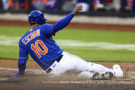 New York Mets' Eduardo Escobar scores on a sacrifice fly by New York Mets' Dominic Smith against the Philadelphia Phillies during the second inning of a baseball game Saturday, May 28, 2022, in New York. (AP Photo/Jessie Alcheh)