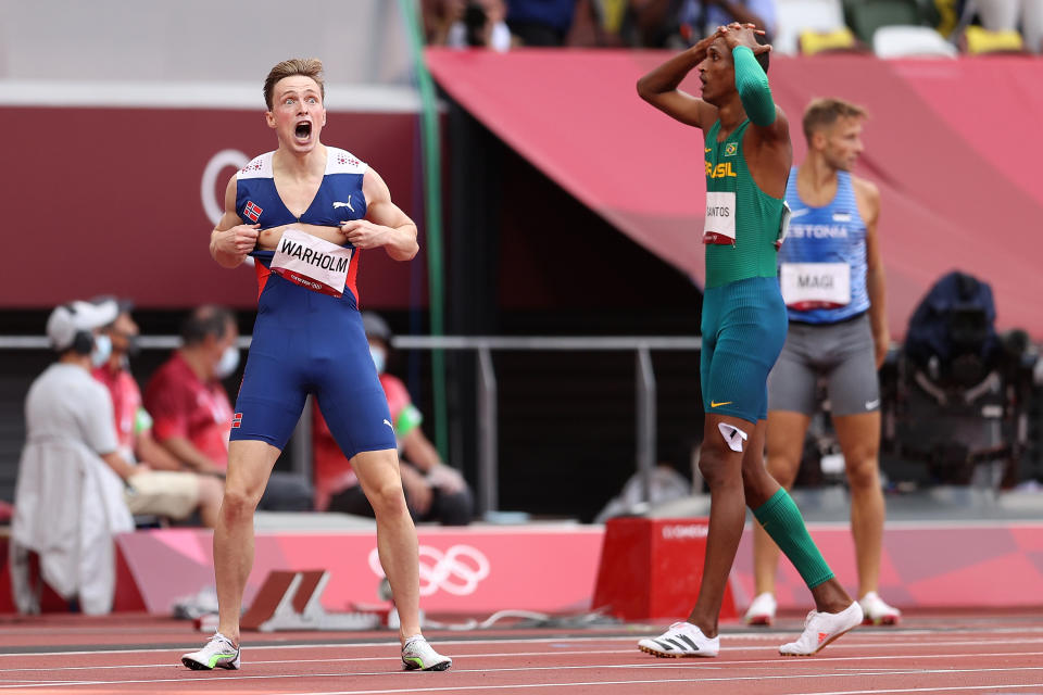 <p>Karsten Warholm of Team Norway and Alison dos Santos of Team Brazil react after finishing first and third respectively in the Men's 400m Hurdles Final on day eleven of the Tokyo 2020 Olympic Games at Olympic Stadium on August 03, 2021 in Tokyo, Japan. (Photo by Patrick Smith/Getty Images)</p> 