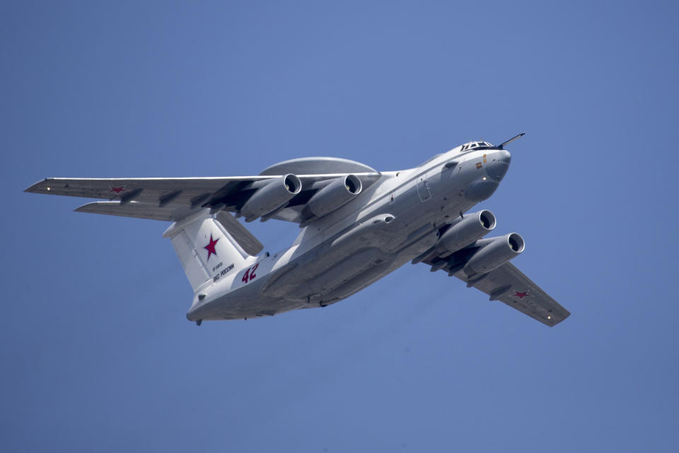 FILE - In this file photo taken on Tuesday, May 7, 2019, A Russian Beriev A-50 airborne early warning and control training aircraft flies over Red Square during a rehearsal for the Victory Day military parade in Moscow, Russia. After Russia invaded Ukraine, guerrillas from Belarus began carrying out acts of sabotage on their country's railways, including blowing up track equipment to paralyse the rails that Russian forces used to get troops and weapons into Ukraine. (AP Photo/Alexander Zemlianichenko, Pool, File)