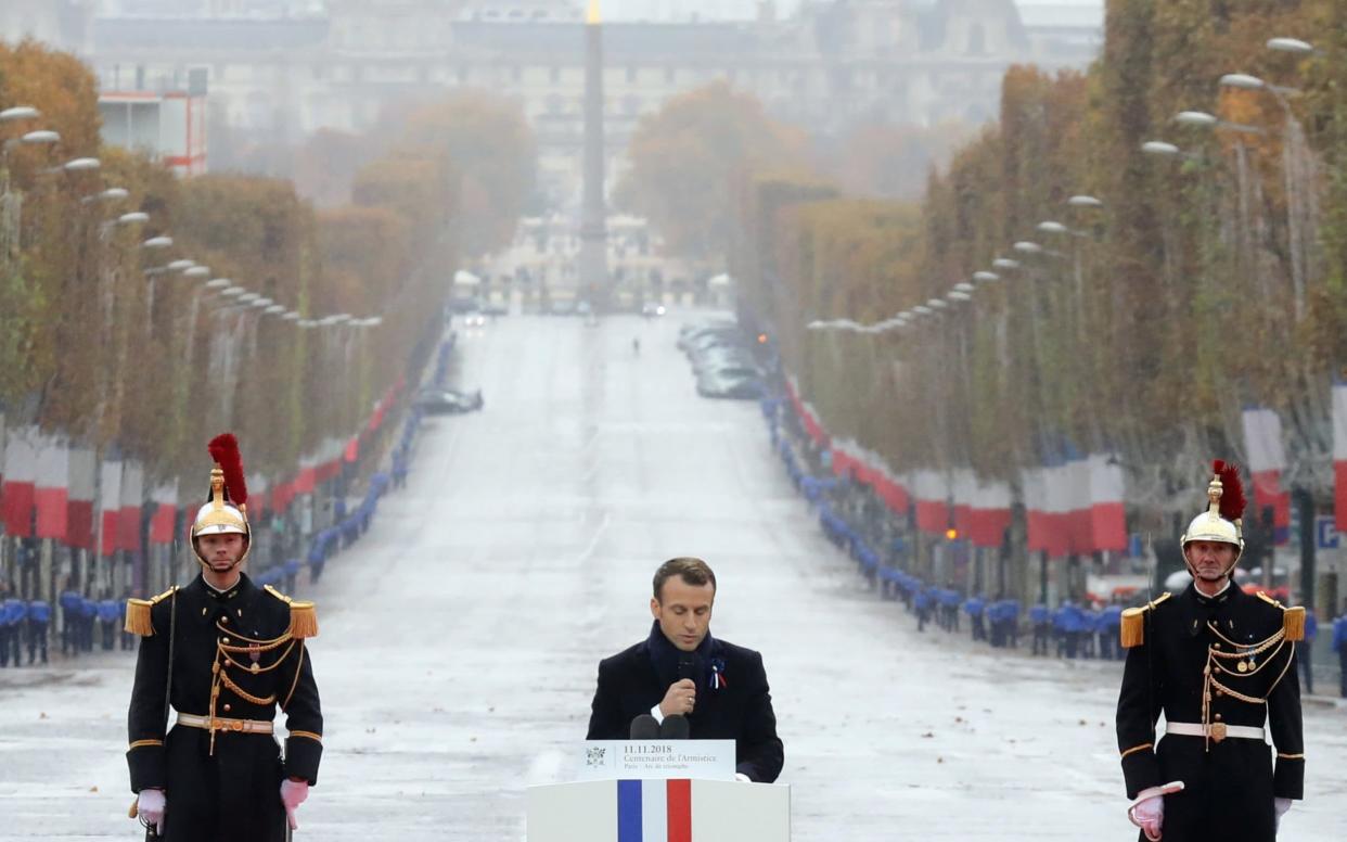 Emmanuel Macron delivers a speech at the Arc de Triomphe during a commemoration ceremony for Armistice Day - REUTERS