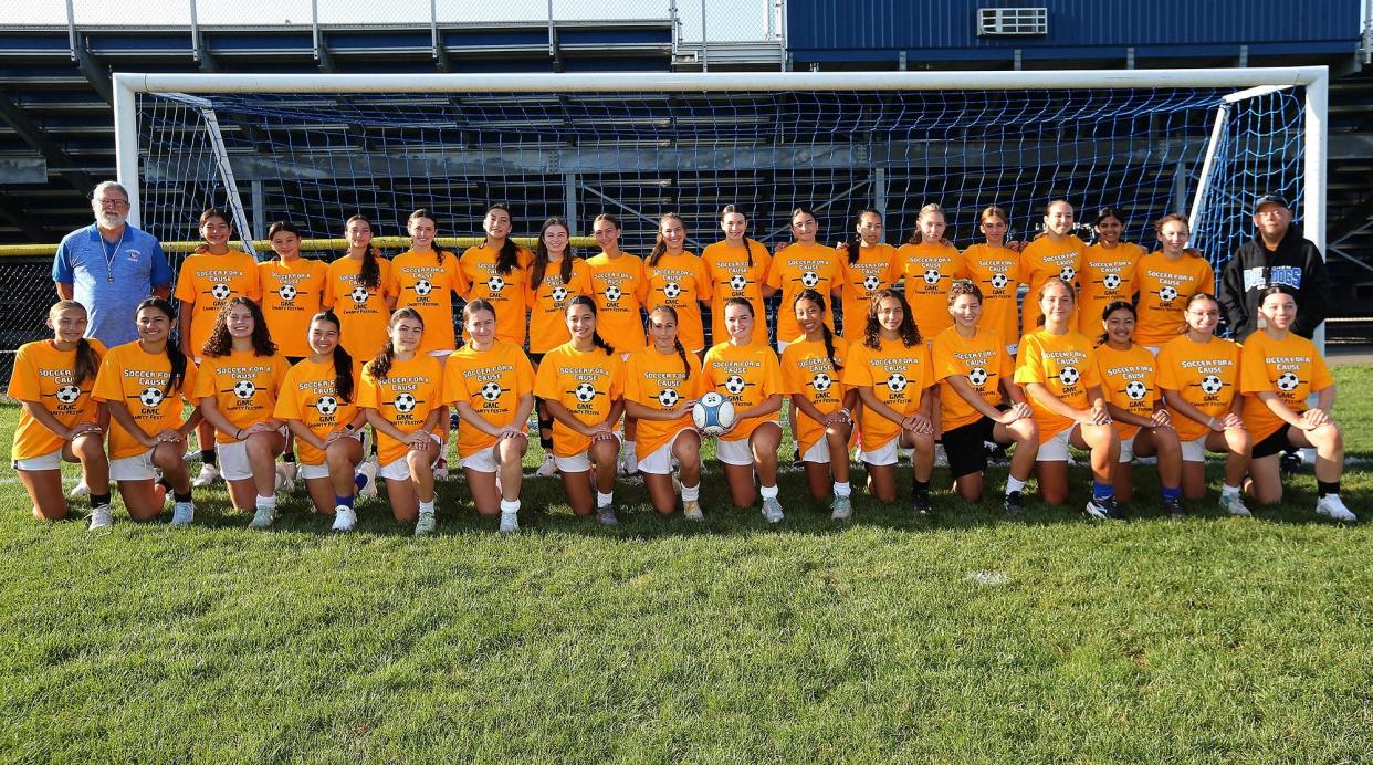 The Metuchen High School girls soccer team sporting their GMC Soccer for a Cause Charity Festival shirts.