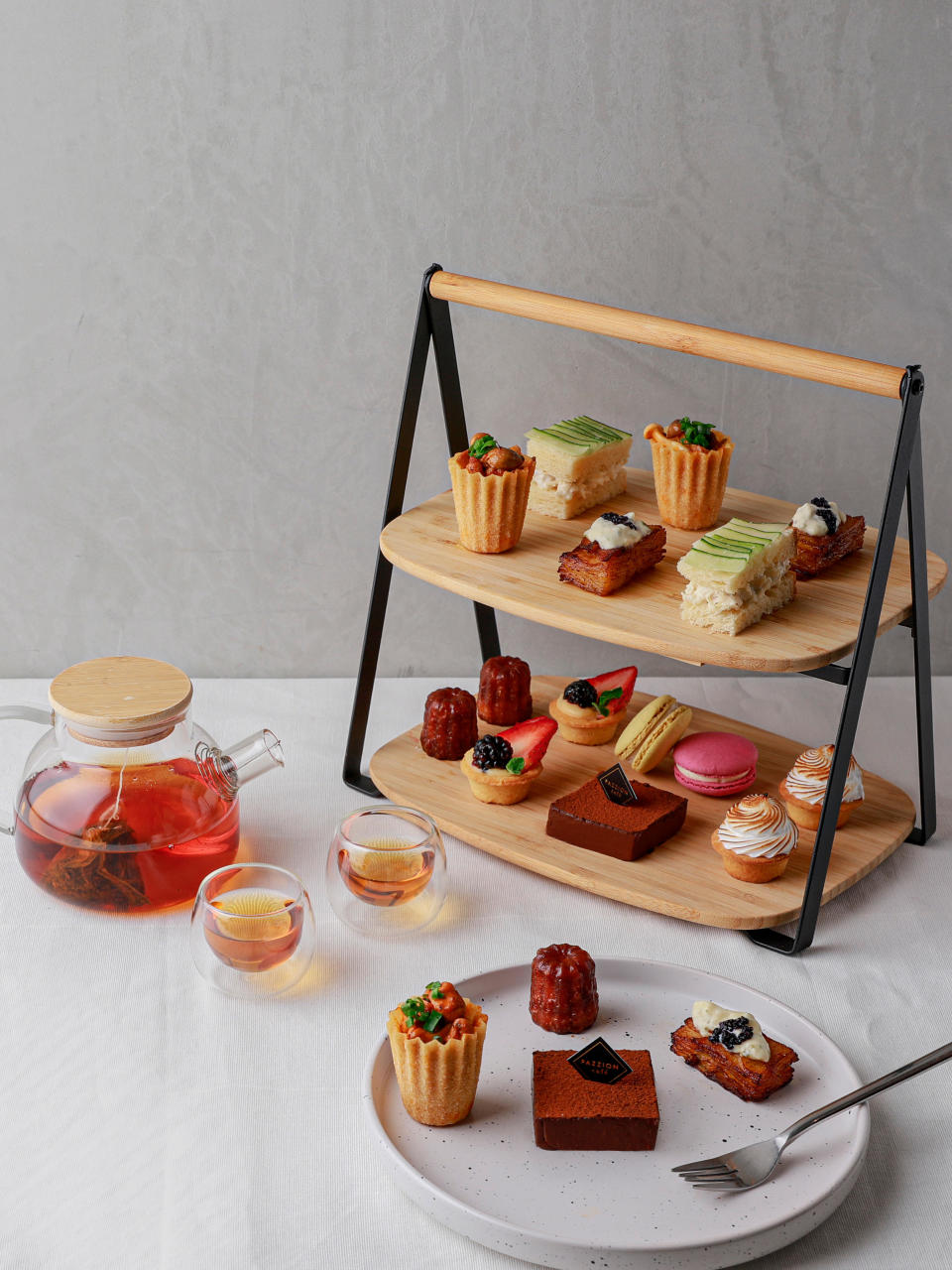 Retailing at $49.00, this PAZZION Mother's Day High Tea set includes savoury mini sandwiches and pie tees, finished with an array of meringues, pudding and fruit tarts. (Photo: PAZZION)