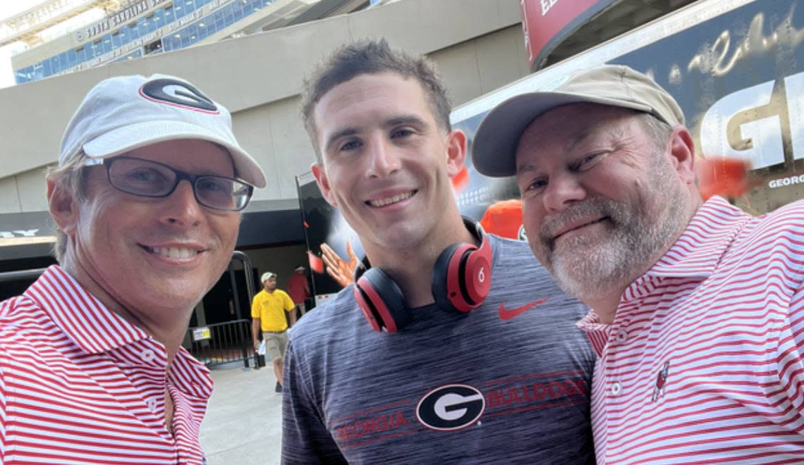 Quarterback Stetson Bennett IV (center) with his father, Stetson Bennett III (left) and family friend Moye Howard before the 2022 football game between South Carolina and Georgia at Williams-Brice Stadium.