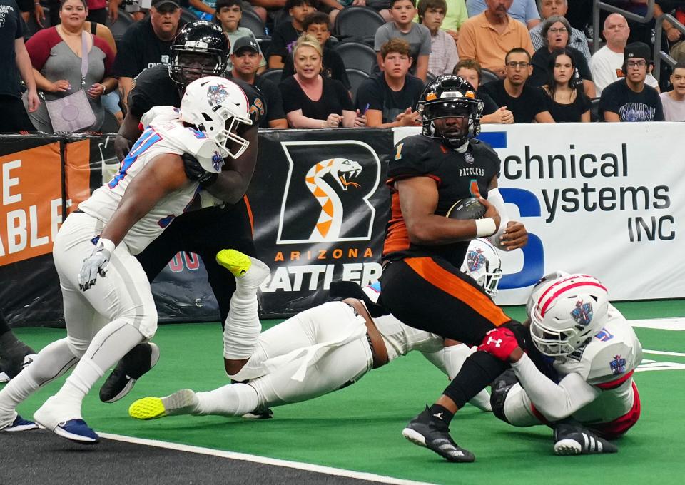 July 30, 2022;  Phoenix, Arizona; USA; Rattlers quarterback Drew Powell (1) spins into the endzone against the Wranglers for a touchdown during a playoff game at the Footprint Center.