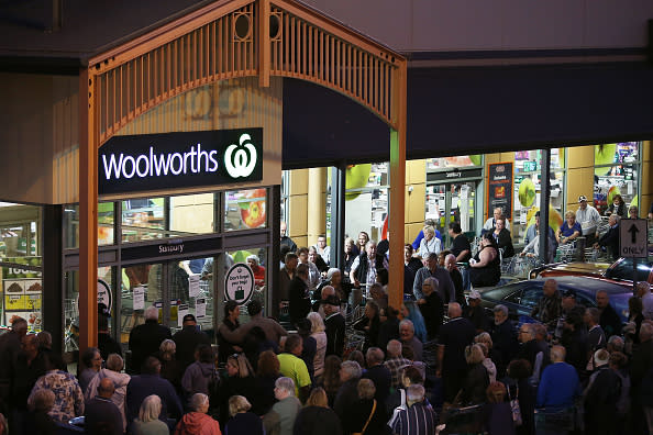General view outside a Woolworths in Sunbury as people wait outside.