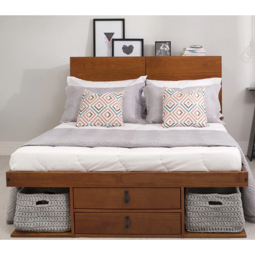 medium-wood storage bed with a white comforter and multi-colored pillows