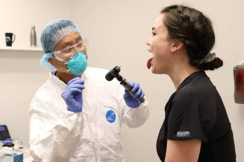 People line up to be tested for coronavirus disease in Phoenix