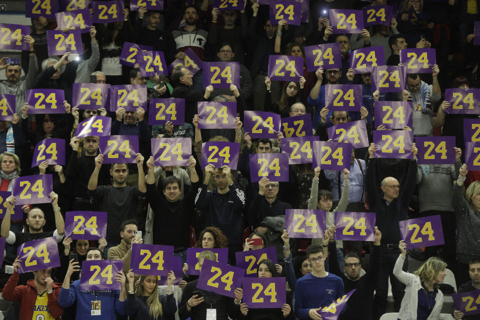 FILE - In this Feb. 5, 2020, file photo, spectators pay tribute to basketball legend Kobe Bryant prior to the start of the Italian Basketball second division match between Rieti and Scafati in Rieti's PalaSojourne, Italy. Bryant spent seven years of his childhood in Rieti, where his father, Joe Bryant, made his Italian basketball debut in 1984 when Kobe was 6 years-old. (AP Photo/Gregorio Borgia, File)