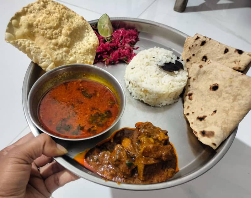 grated salad and goat curry