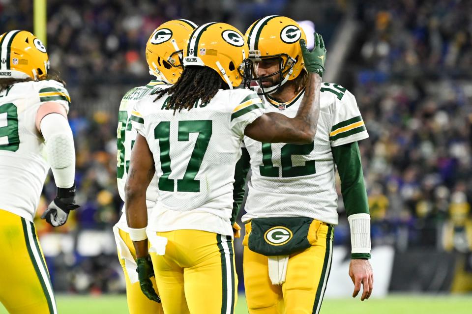 Green Bay Packers wide receiver Davante Adams celebrates with quarterback Aaron Rodgers after scoring a second quarter touchdown against the Baltimore Ravens on Sunday, Dec. 19, 2021, at M&T Bank Stadium in Baltimore. Adams passed Jordy Nelson for second place on the Packers' all-time touchdown receptions list with 70.