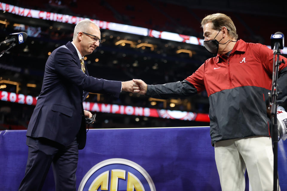 ATLANTA, GA - DECEMBER 19: Head Coach Nick Saban of the Alabama Crimson Tide fist bumps Southeastern Conference Commissioner Greg Sankey after the victory over the Florida Gators in the SEC Championship at Mercedes-Benz Stadium on December 19, 2020 in Atlanta, Georgia. (Photo by UA Athletics/Collegiate Images/Getty Images)