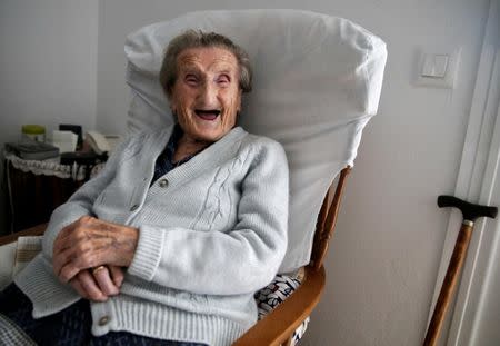 Maria Josefa Guillen, 103, laughs at her home in Cazalla de la Sierra, Seville, southern Spain, September 18, 2016. Guillen lives with her disabled son. She started working as a seamstress aged 12 and laughs when she recalls that the first item she had to sew was a ball gown. Guillen loves gazpacho Ð a traditional Spanish cold tomato and cucumber soup. REUTERS/Andrea Comas