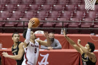 Alabama guard Jaden Shackelford (5) gets by Vanderbilt forward Dylan Disu (1) and guard/forward Braelee Albert (11) for a shot during the second half of an NCAA basketball game on Saturday, Feb. 20, 2021, in Tuscaloosa, Ala. (AP Photo/Vasha Hunt)