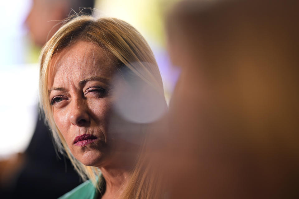 Italy's Prime Minister Giorgia Meloni pauses while speaking with the media on the second day of the Europe Summit in Granada, Spain, Friday, Oct. 6, 2023. European Union leaders have pledged Ukrainian President Volodymyr Zelenskyy their unwavering support. On Friday, they will face one of their worst political headaches on a key commitment. How and when to welcome debt-laden and war-battered Ukraine into the bloc. (AP Photo/Manu Fernandez)