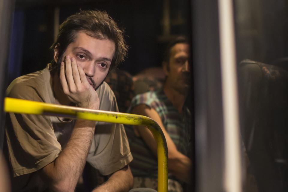 Members of the pro-Russian rebels, who are prisoners-of-war, sit in a bus as they wait to be exchanged, north of Donetsk, eastern Ukraine