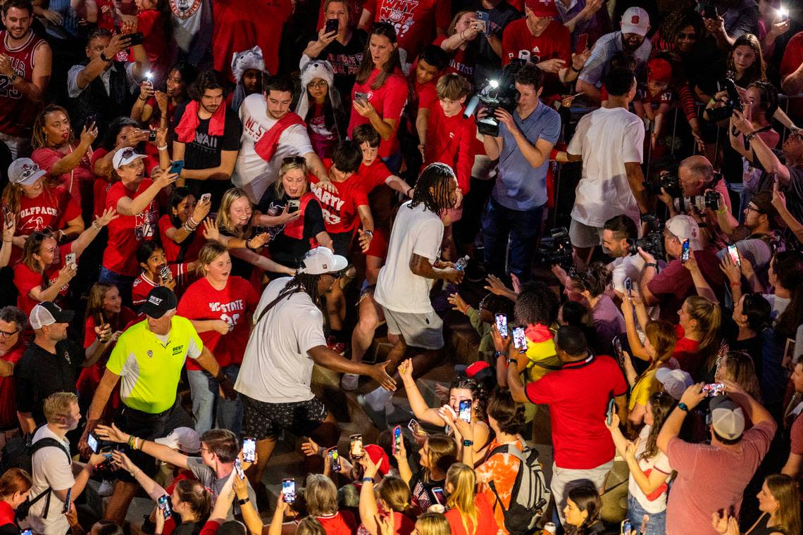 NC State’s DJ Burns and DJ Horn are greeted at the Memorial Belltower as more than a thousand fans celebrate the men’s and women’s basketball teams’ Final Four runs on Monday, April 15, 2024.