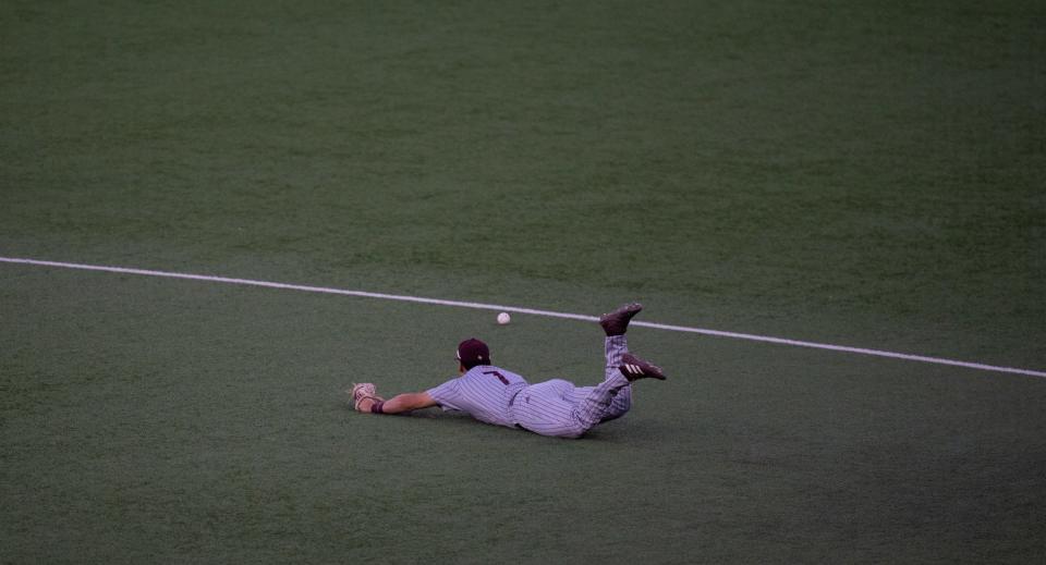 Texas State infielder Daylan Pena dives for a ball but can't come up with it during the fourth inning Tuesday. The Bobcats answered Monday's 5-2 Texas win in San Marcos with a win over the Longhorns at UFCU Disch-Falk Field. Texas still leads the all-time series 55-14.