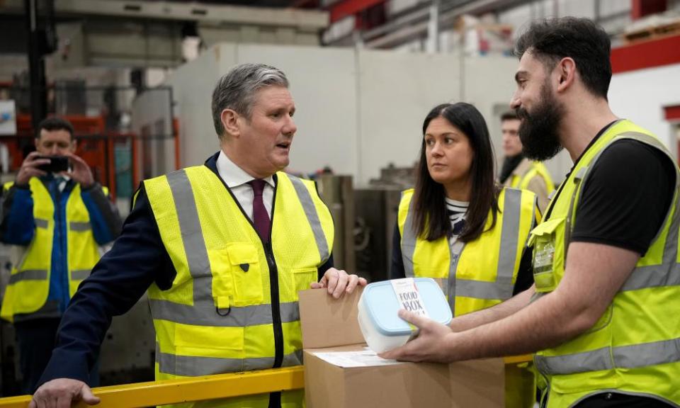 Keir Starmer and Lisa Nandy talking to an employee at What More UK’s plastic products factory in Burnley, England