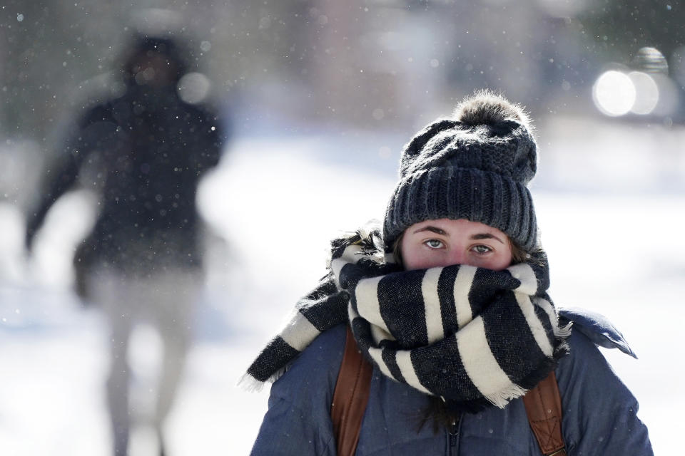 Jillian Hansen, a senior at the University of Minnesota studying political science, walks on campus wrapped up in an oversized scarf as snow flurries floated in the air, Jan. 29, 2019, in Minneapolis. (Photo: Anthony Souffle/Star Tribune via AP)