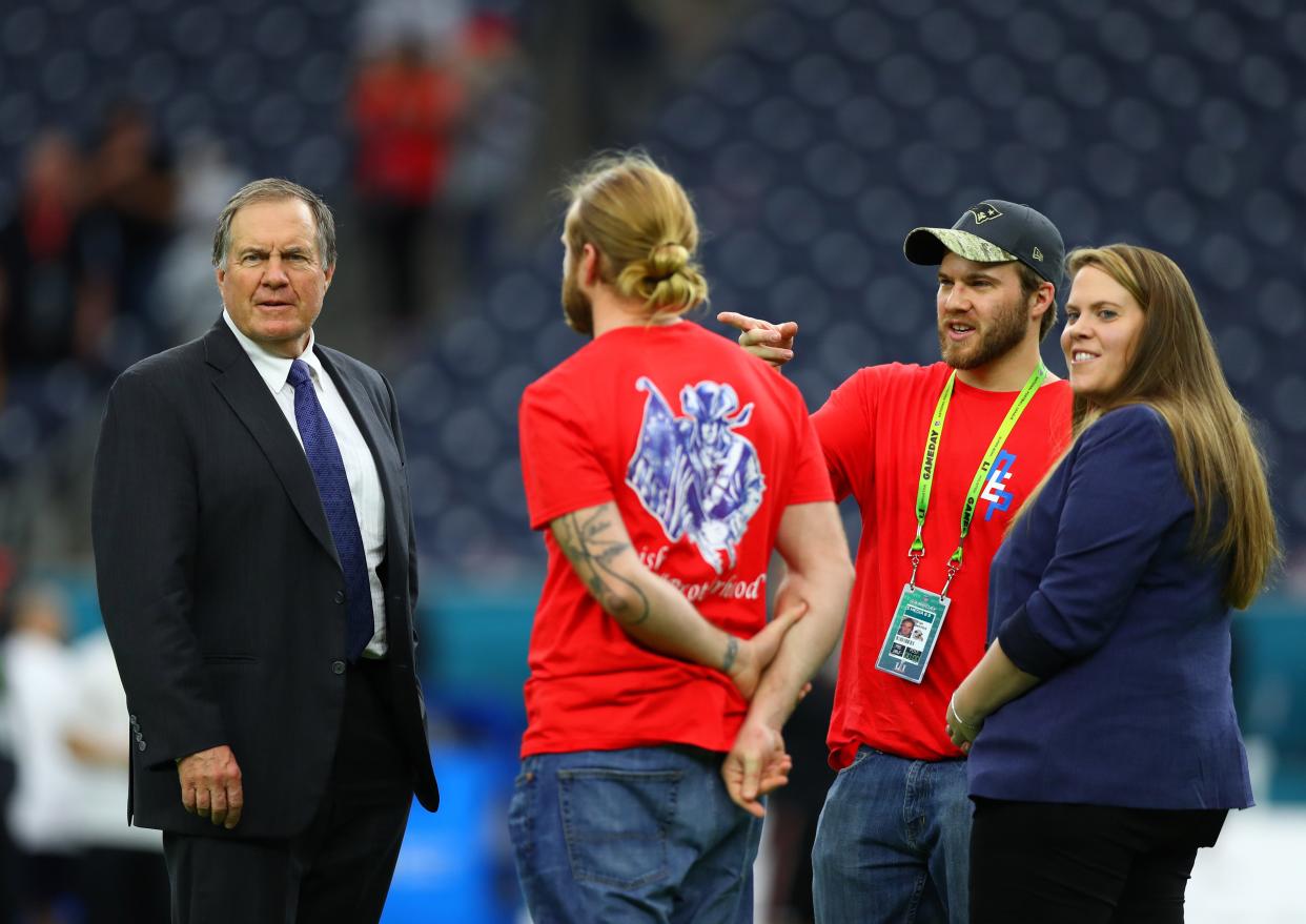 Then-Patriots head coach Bill Belichick talks with sons Steve, center, and Brian Belichick and daughter Amanda before Super Bowl LI against the Atlanta Falcons at NRG Stadium in Houston on Feb. 5, 2017. Will the sons stay as coaches with the Patriots or perhaps go to another team with their father?