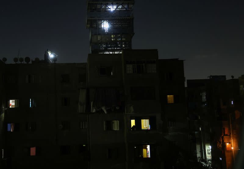 A general view shows different dark areas in the capital Cairo