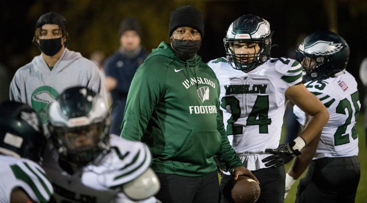 Winslow Township High School's football coach Kenny Scott, center, takes to the field prior to the football game between Winslow Township and Holy Spirit, played at Holy Spirit High School in Absecon on Friday, November 13, 2020.