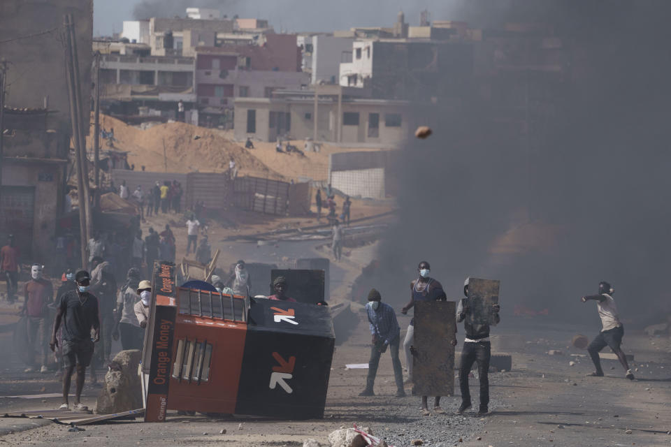 Demonstrators clash with riot policemen at a neighborhood in Dakar, Senegal, Friday, June 2, 2023. Clashes between police and supporters of Senegalese opposition leader Ousmane Sonko left nine people dead, the government said Friday, with authorities issuing a blanket ban on the use of several social media platforms in the aftermath of the violence (AP Photo/Leo Correa)