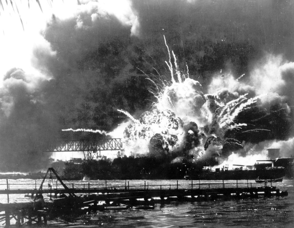 FILE - In this photo released by the U.S. Navy, the destroyer USS Shaw explodes after being hit by bombs during the Japanese surprise attack on Pearl Harbor, Hawaii, December 7, 1941. A few centenarian survivors of the attack on Pearl Harbor are expected to gather at the scene of the Japanese bombing on Wednesday, Dec. 7, 2022, to remember those who perished 81 years ago. (U.S. Navy via AP)