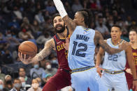 Cleveland Cavaliers' Ricky Rubio (3) shoots while defended by Memphis Grizzlies guard Ja Morant (12) during the first half of an NBA basketball game Wednesday, Oct. 20, 2021, in Memphis, Tenn. (AP Photo/Nikki Boertman)