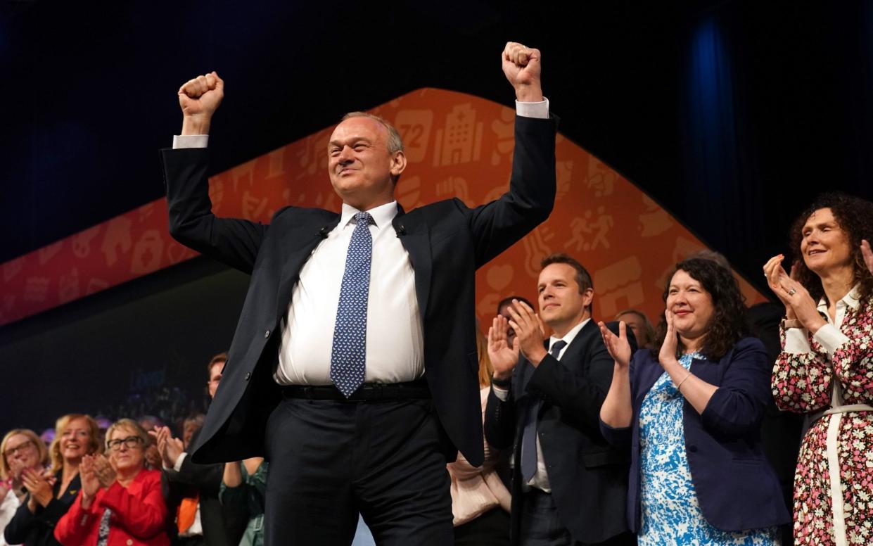 The Liberal Democrat leader Sir Ed Davey arriving on stage to give his keynote speech