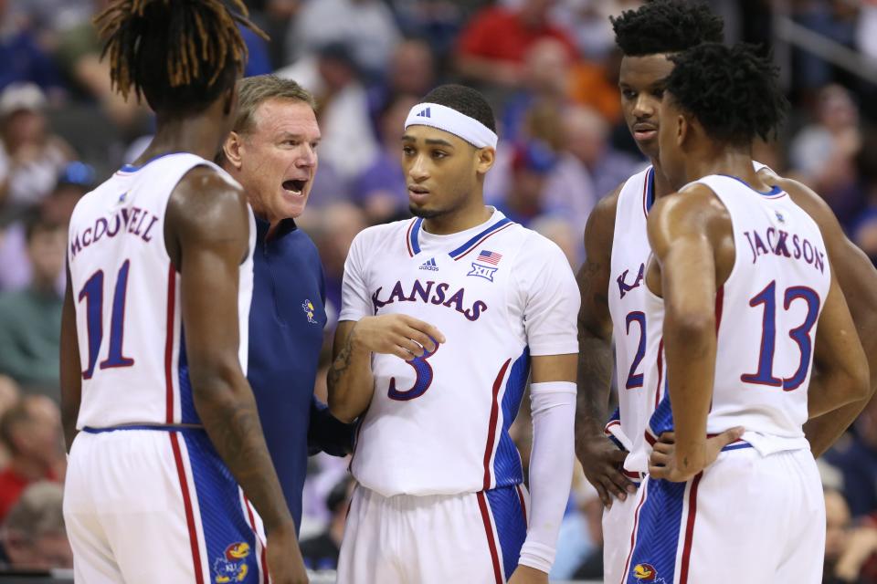 Kansas basketball coach Bill Self brings his players in for a huddle in the second half of a Big 12 Conference tournament second round game March 13, 2024 inside the T-Mobile Center in Kansas City.