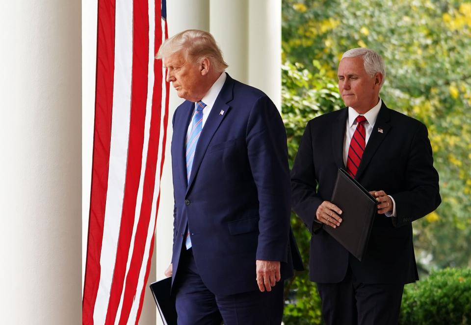 In this photo taken on Sept. 28, 2020, US President Donald Trump and Vice President Mike Pence arrive in the Rose Garden to speak on Covid-19 testing at the White House in Washington, DC.