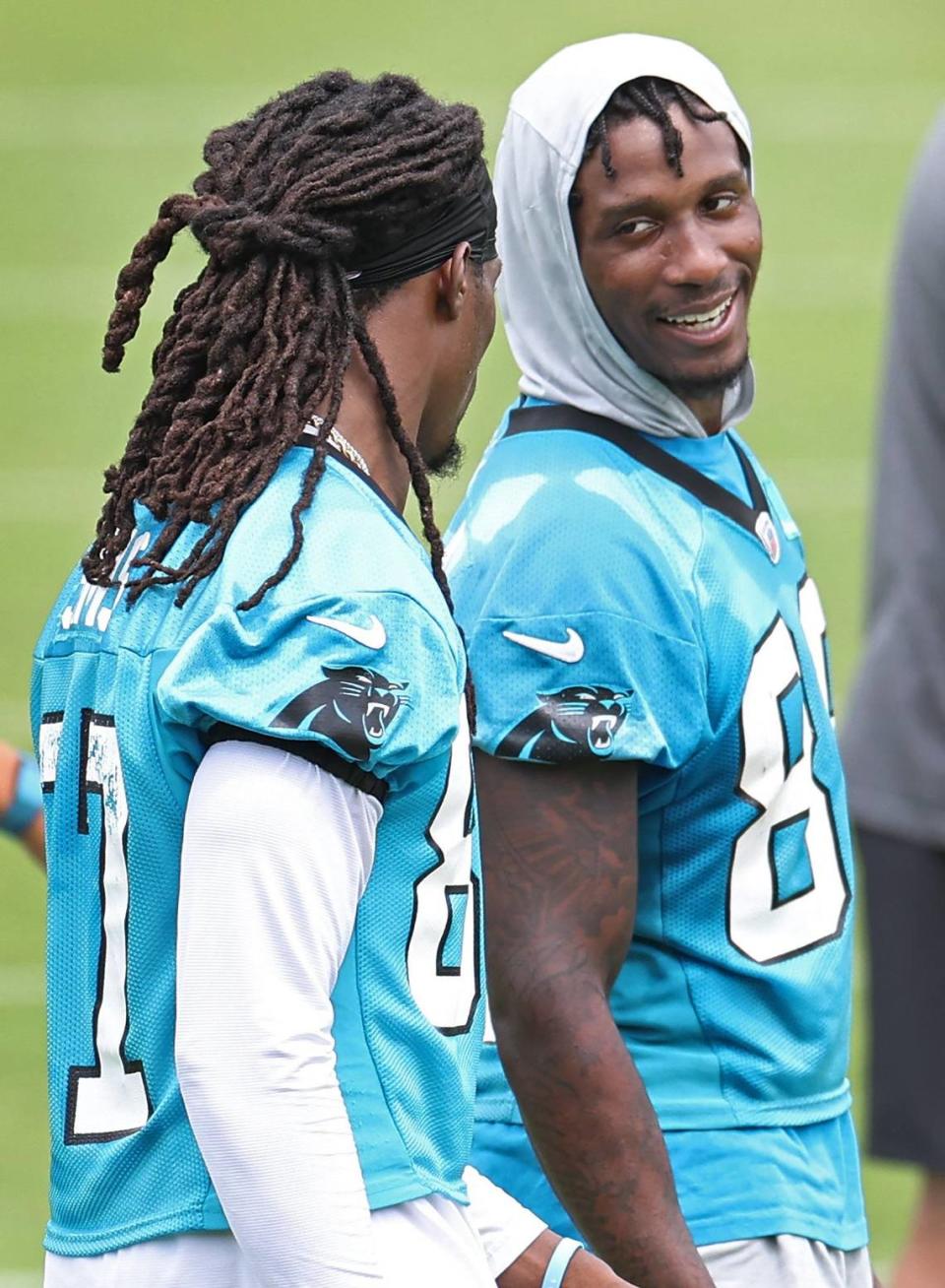 Carolina Panthers wide receiver Terrace Marshall Jr., right, speaks with wide receiver Cam Sims, left, during the team’s OTA practice on Tuesday, June 4, 2024.