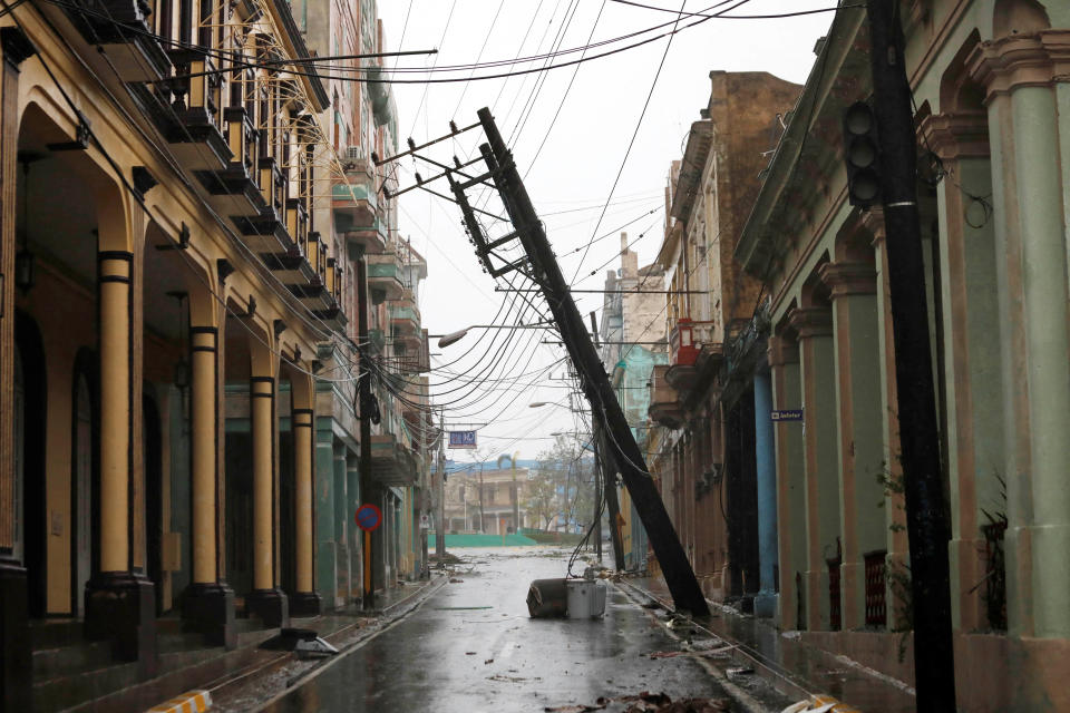 A downed pole is seen on the street in the aftermath of Hurricane Ian's passage through Pinar del Rio, Cuba, September 27, 2022. REUTERS/Alexandre Meneghini