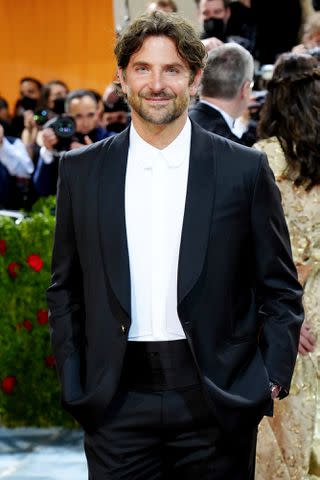 <p>Jeff Kravitz/FilmMagic</p> Bradley Cooper attends the 2022 Met Gala in New York City