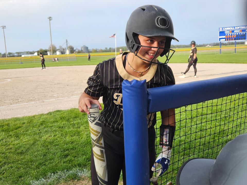Delphi sophomore catcher Airy Lattimore (18) receives hitting advice from coaches before taking an at-bat against Carroll on Thursday, April 18, 2024 in Flora, Ind.