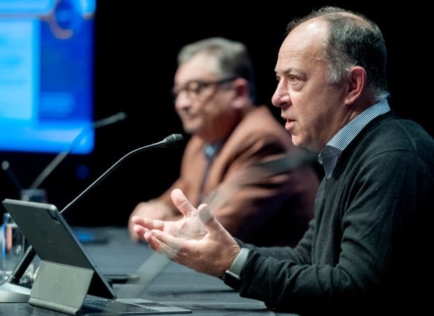 Quebec Health Minister Christian Dube, right, and Public Health Director Horacio Arruda give an update on the COVID-19 pandemic in the province. (Graham Hughes/The Canadian Press - image credit)