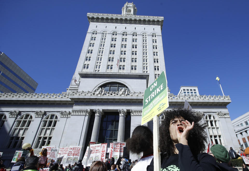 Malika Rubin-Davis, a teacher at Westlake Middle School, yells at a rally with other teachers, students and supporters at Frank Ogawa Plaza in front of City Hall in in Oakland, Calif., Thursday, Feb. 21, 2019. Teachers in Oakland, California, went on strike Thursday in the country's latest walkout by educators over classroom conditions and pay. (AP Photo/Jeff Chiu)