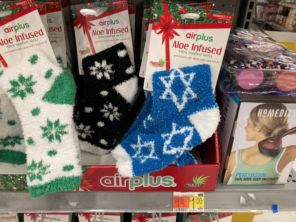 Holiday socks, including a blue pair with Jewish stars, at Walmart.