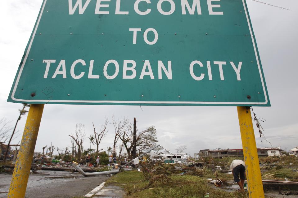 A welcome sign is seen at the entrance of battered Tacloban city, after super Typhoon Haiyan, central Philippines November 9, 2013. Typhoon Haiyan, the strongest typhoon in the world this year and possibly the most powerful ever to hit land battered the central Philippines on Friday, forcing millions of people to flee to safer ground, cutting power lines and blowing apart houses. Haiyan, a category-5 super typhoon, bore down on the northern tip of Cebu Province, a popular tourist destination with the country's second-largest city, after lashing the islands of Leyte and Samar with 275 kph (170 mph) wind gusts and 5-6 meter (15-19 ft) waves. REUTERS/Romeo Ranoco (PHILIPPINES - Tags: DISASTER ENVIRONMENT)