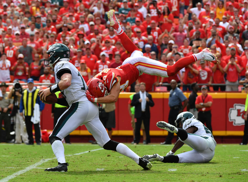 <p>Defensive back Daniel Sorensen #49 of the Kansas City Chiefs leaps to make a sack attempt on quarterback Carson Wentz #11 of the Philadelphia Eagles during the fourth quarter of the game at Arrowhead Stadium on September 17, 2017 in Kansas City, Missouri. ( Photo by Peter Aiken/Getty Images) </p>