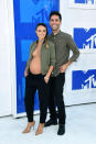 <p>There are plenty of ways to display your baby bump on the red carpet, but Laura Perlongo, Nev Schulman’s fiancée as of this May, might just have put her growing stomach on display in the most unique way possible. Wearing just an open jacket — no shirt or bra — she accessorized with a cross-body chain. <i>(Photo: Getty Images)</i> </p>