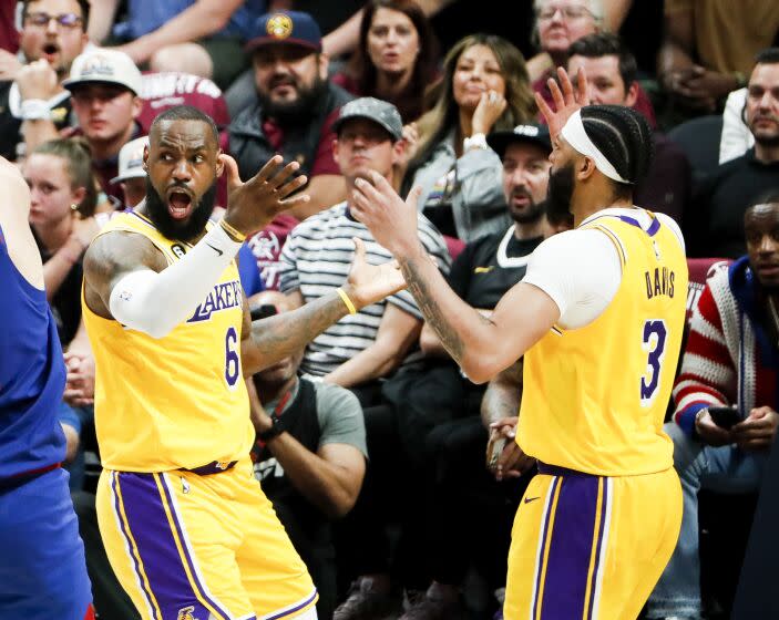 DENVER, CO - MAY 16: Los Angeles Lakers forward Anthony Davis, right, and forward LeBron James react to a call during the second half of game one in the NBA Playoffs Western Conference Finals against the Denver Nuggets at Ball Arena on Tuesday, May 16, 2023 in Denver, CO. (Robert Gauthier / Los Angeles Times)