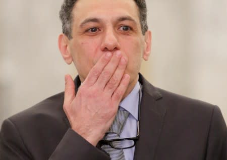 Freed Lebanese businessman Nizar Zakka, who had been detained in Iran since 2015, gestures as he arrives at the Presidential Palace in Baabda
