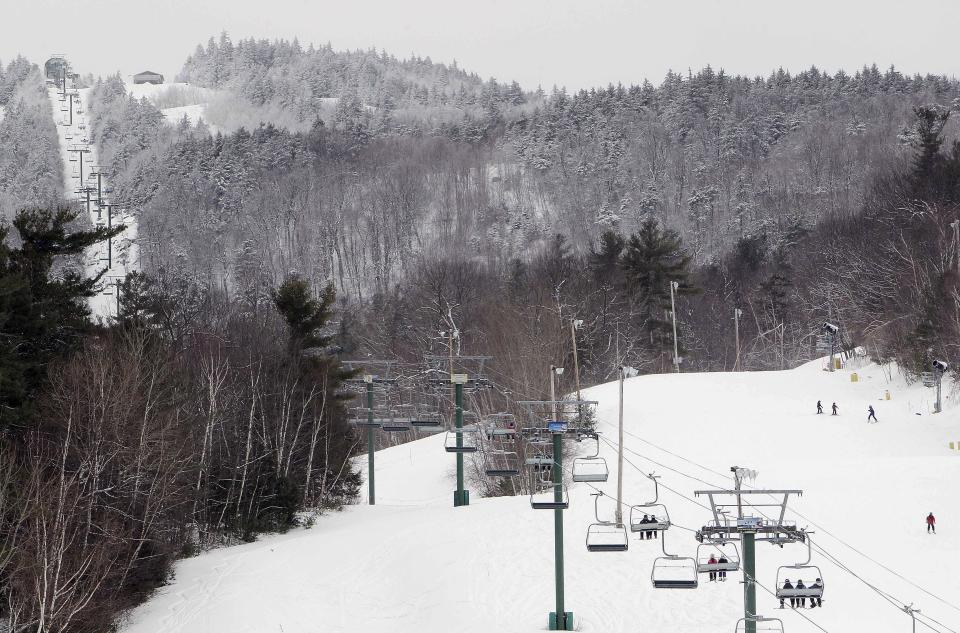 Skiers and snowboarders take to the slopes on Feb. 14, 2014, at Gunstock Ski area in Gilford, N.H. A recent controversy at the county-owned ski area has raised questions about New Hampshire Gov. Chris Sununu's grip on the Republican Party heading into the November elections. Sununu, who is seeking his fourth term, recently inserted himself into a power struggle over Gunstock Mountain Resort, siding with staff who quit en masse and forced a two-week shutdown last month. (AP Photo/Jim Cole, File)